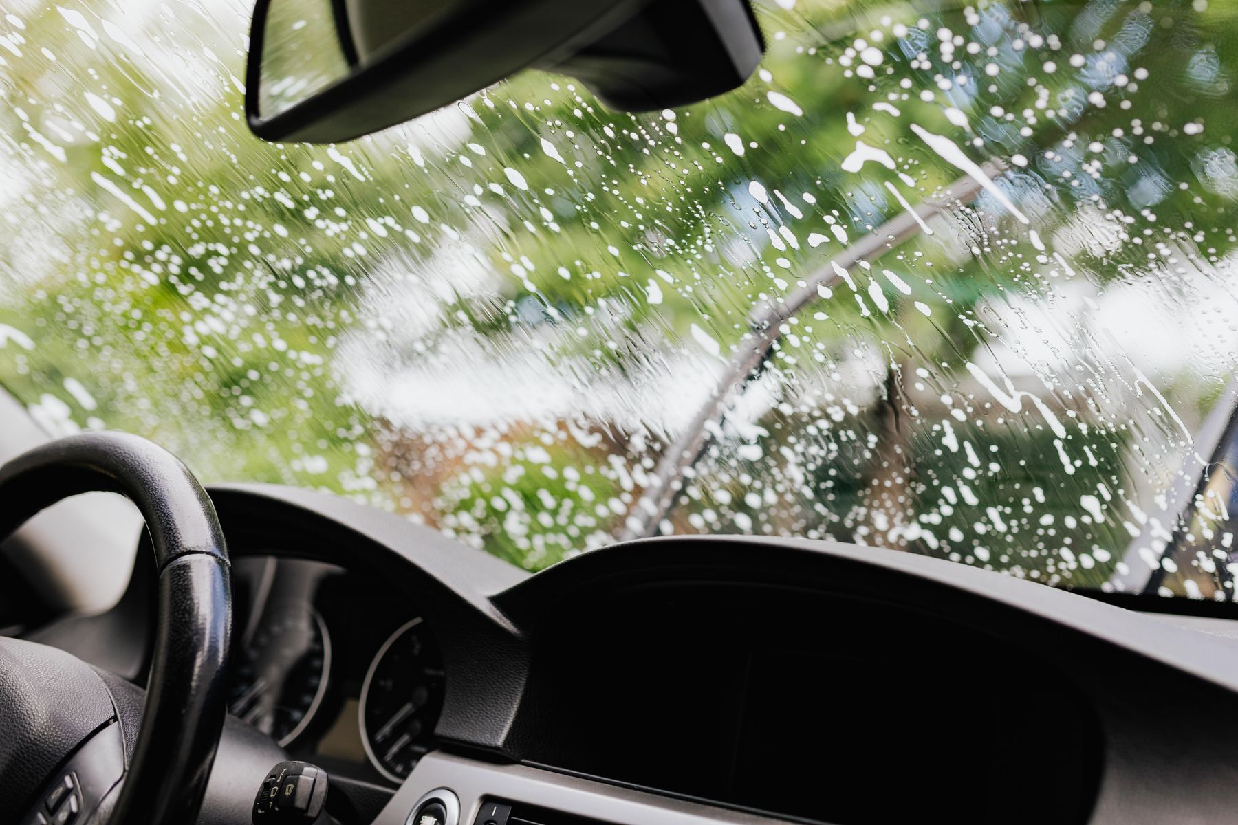Vehicle windshield covered in soapy water